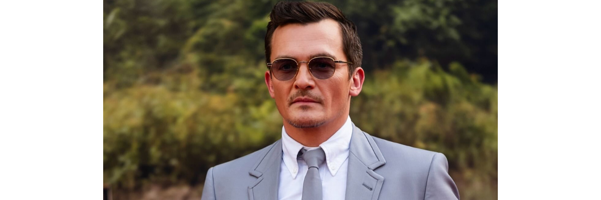 Rupert Friend Wears Leisure Society on the Jurassic World Red Carpet