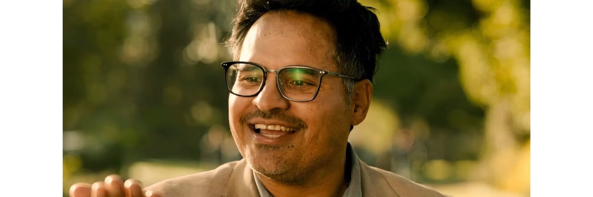 Michael Peña Wearing the Sadeler in Good Luck, Have Fun, Don’t Die
