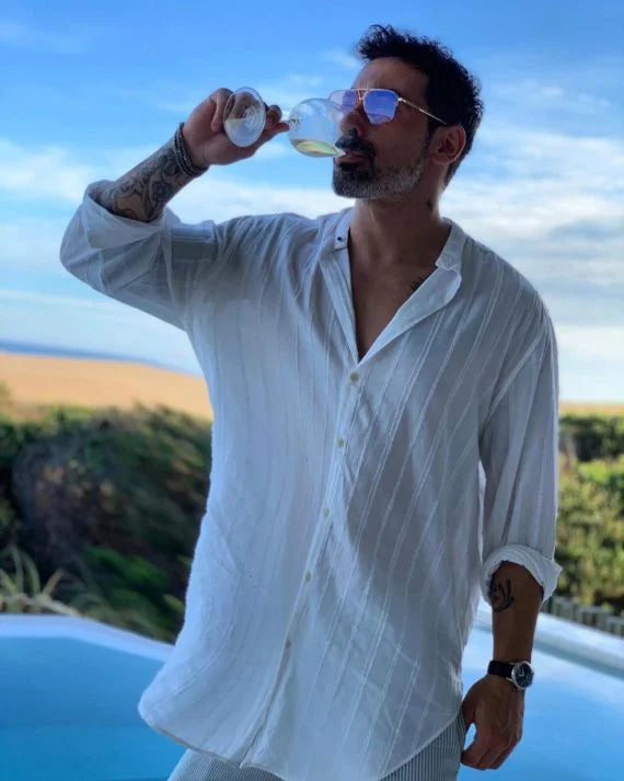 Ezequiel Lavezzi wearing the Presidio in 18k Rose Gold with Peach Tinted Lenses